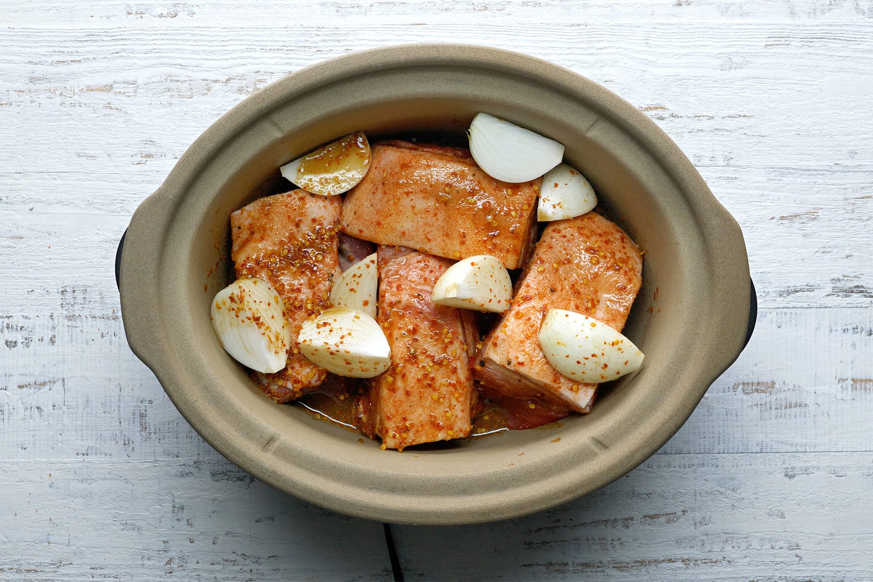 overhead shot; white textured background; pour mixture over roast;
