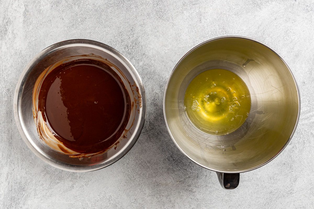 Taste of Home Chocolate Olive Oil Cake recipe photo of the melted chocolate in one bowl and the egg whites in another.