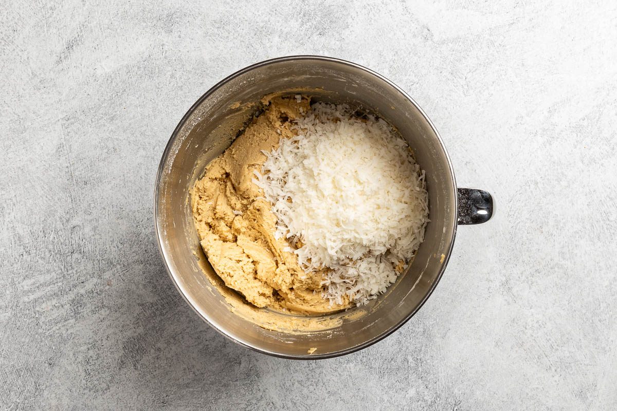 Taste of Home Coconut Cookies recipe photo of combining the dry and wet ingredients in a mixing bowl.