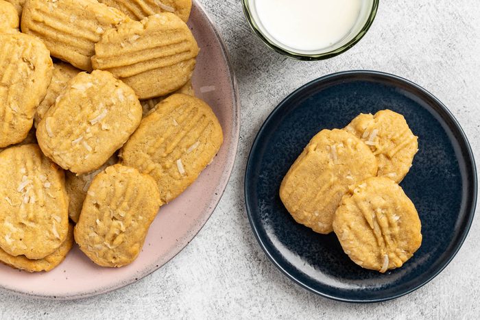 Taste of Home Coconut Cookies recipe photo of the finished recipe on a serving platter and plates.