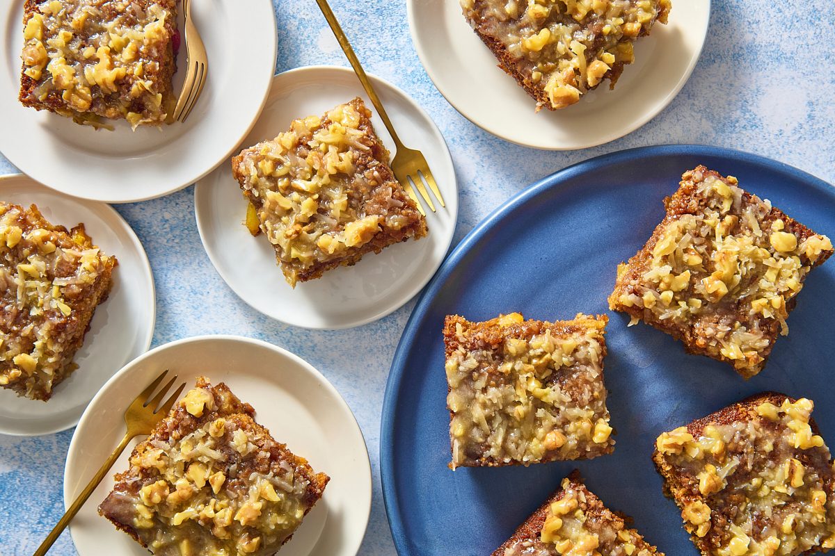Overhead shot of several slices of fruit cocktail cake on different plates
