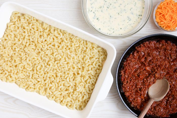 Assembling hamburger macaroni casserole