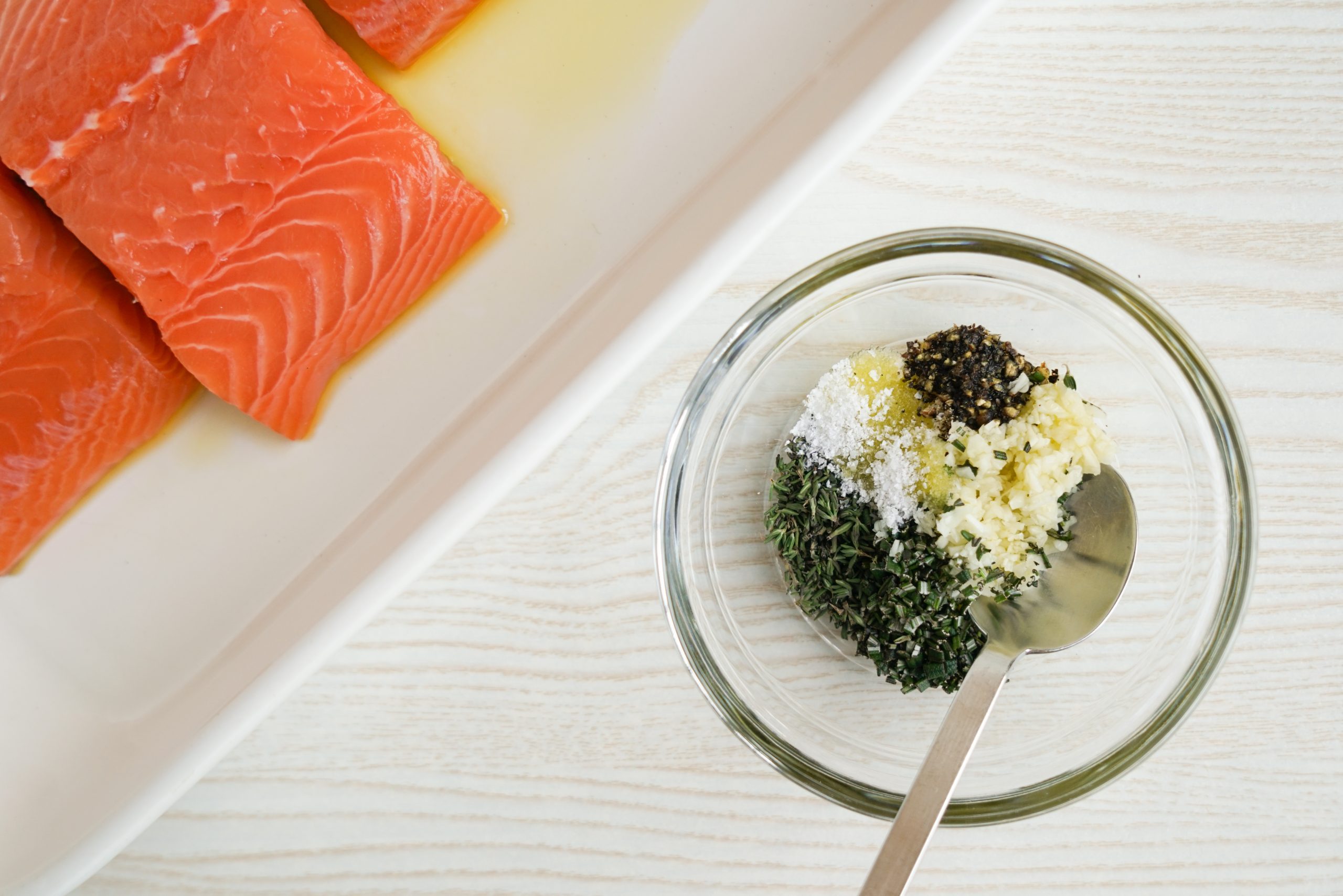 Preparing herb rub for roast herb salmon