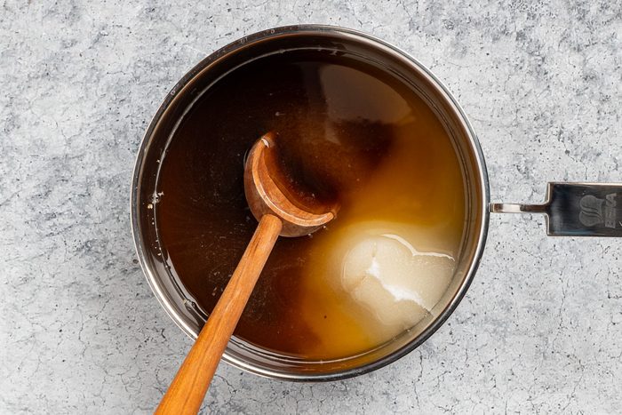 Taste of Home Homemade Pancake Syrup recipe photo of cooking down sugars in a saucepan.