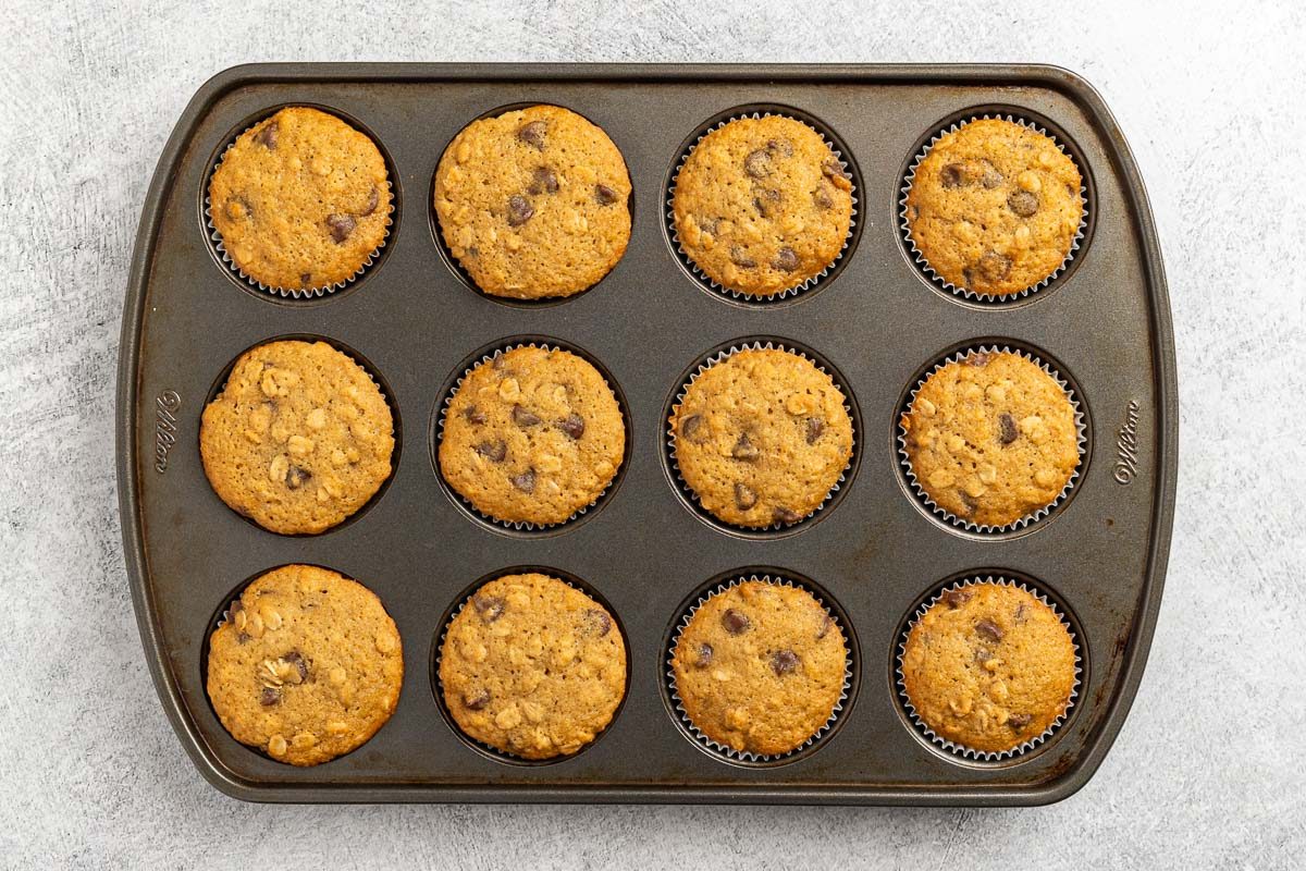 Taste of Home Oatmeal Chocolate Chip Muffins recipe photo of the baked muffins in a muffin tin.