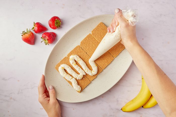 Make the layers in the Banana Split Cake.