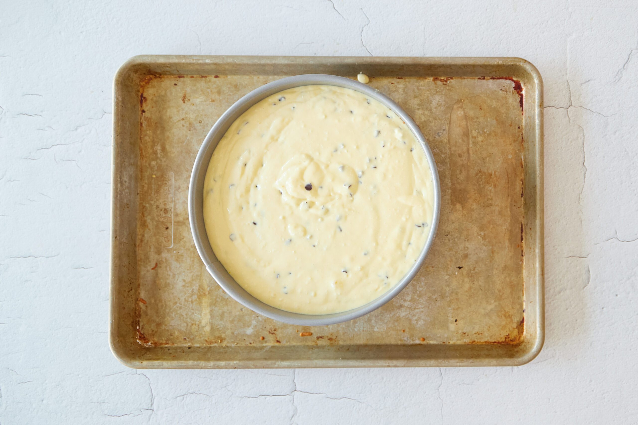 Bake the chocolate chip cookie cheesecake.