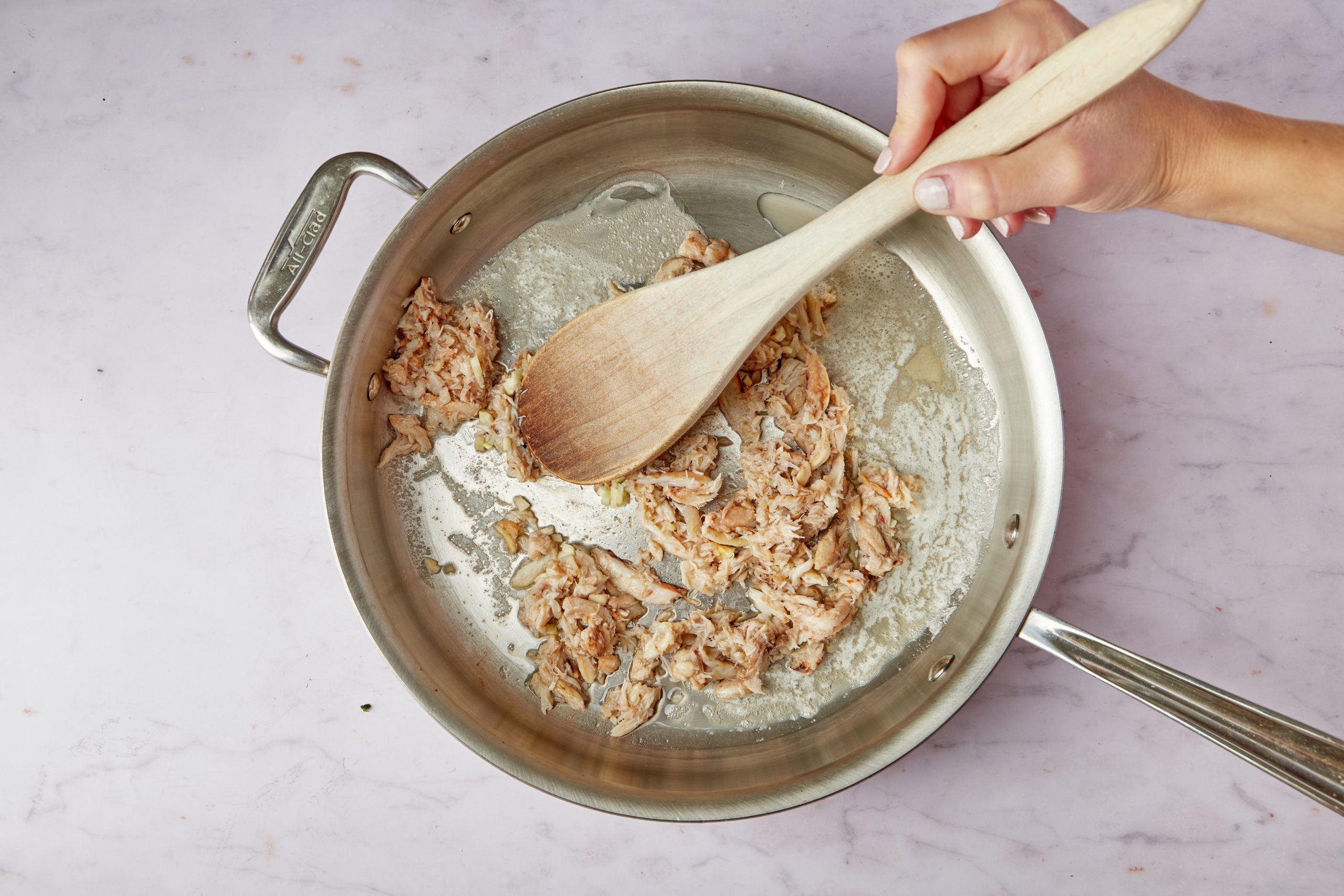 Cook The Crab Meat With Lemon And Garlic.