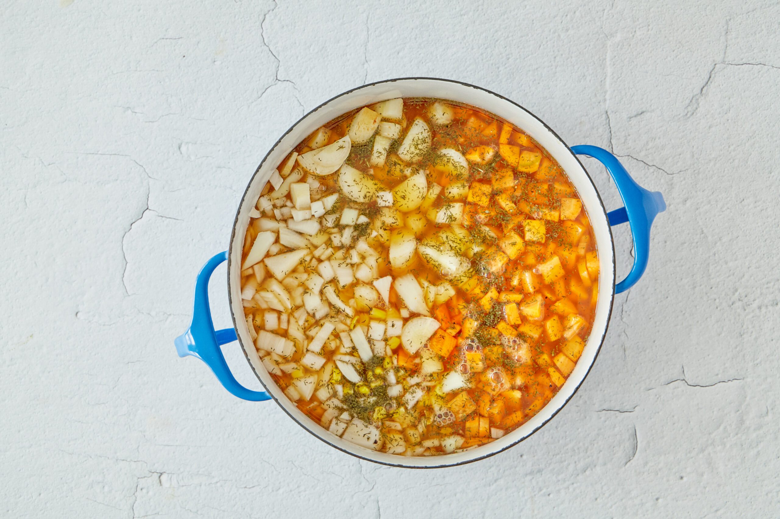 Cook the vegetables for chicken and biscuits.