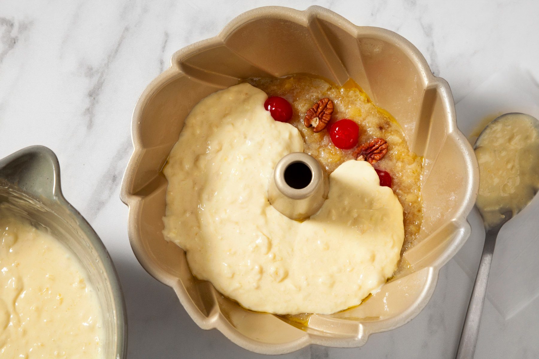cake batter spread over pineapple topping mixture.