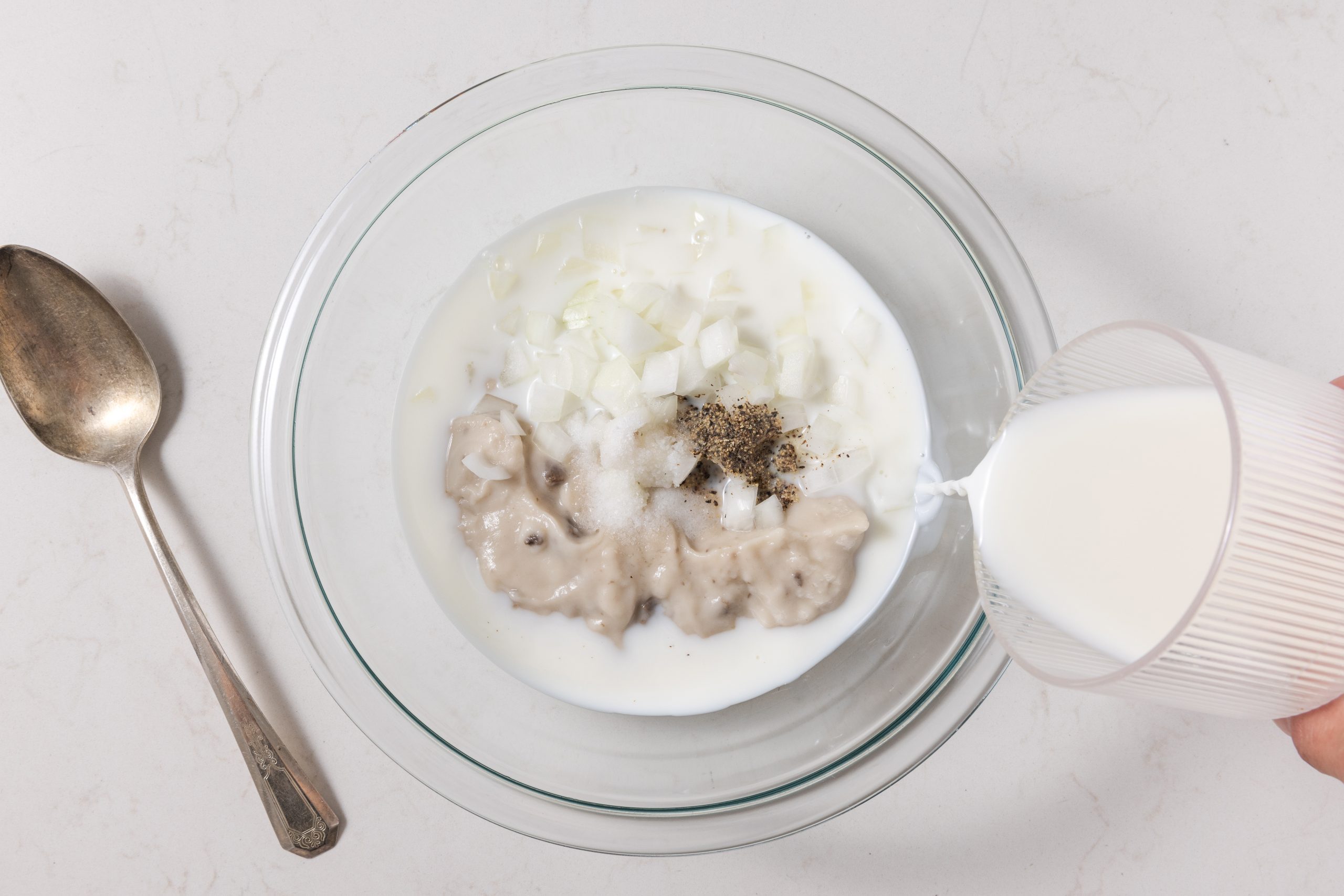 Sauce being mixed in small bowl.