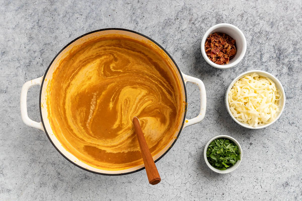 Taste of Home Pumpkin Bisque recipe photo of the heavy whipping cream added to the soup.