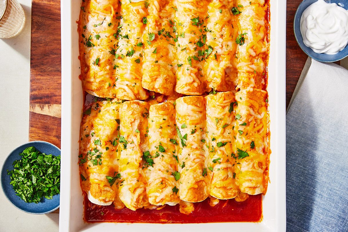 Smoky Sweet Potato And Black Bean Enchiladas Step 4/ Hero- finished enchiladas in 9x13 topped with cilantro