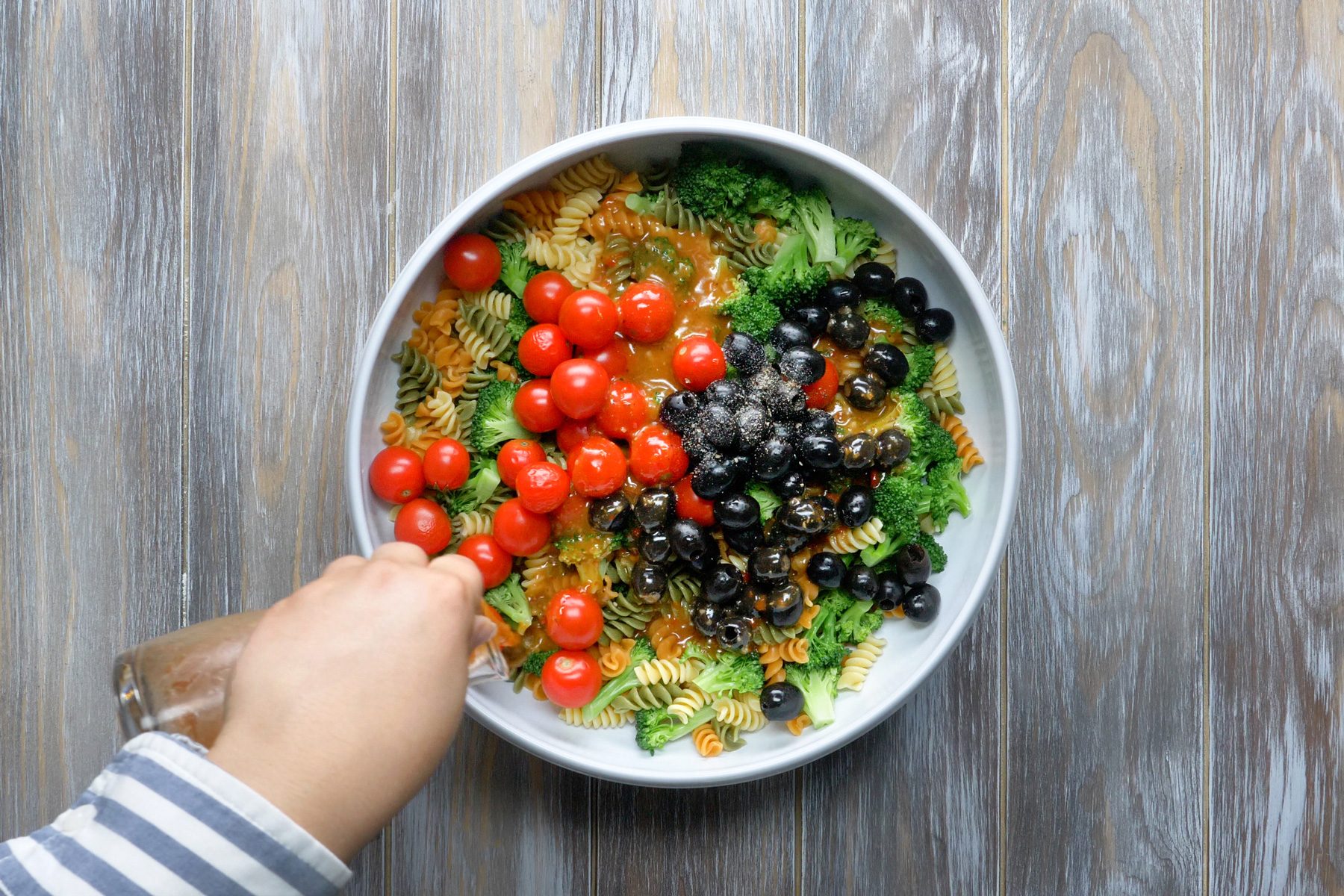 Overhead shot of broccoli with vegetables and pasta