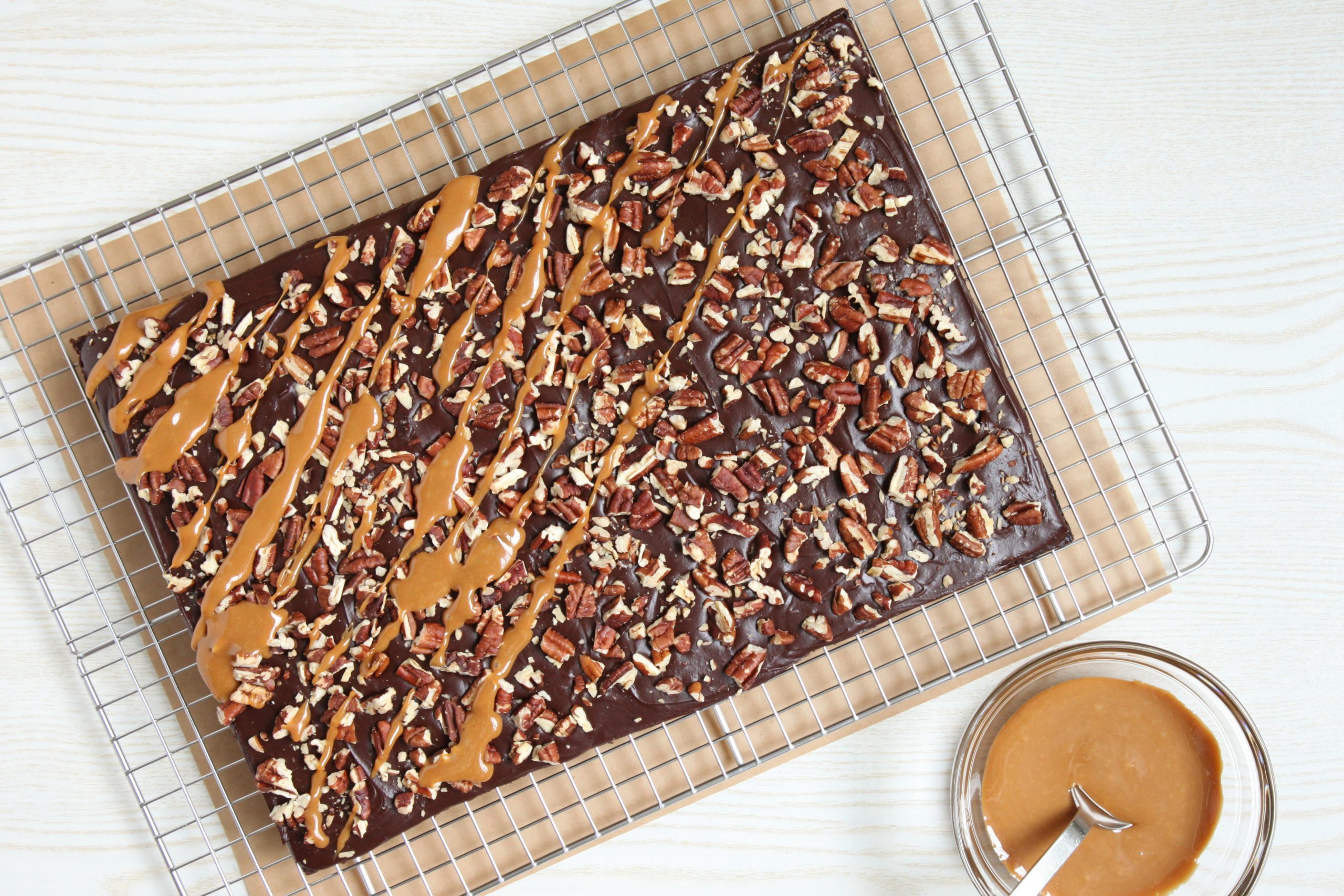 Drizzling turtle brownies with caramel
