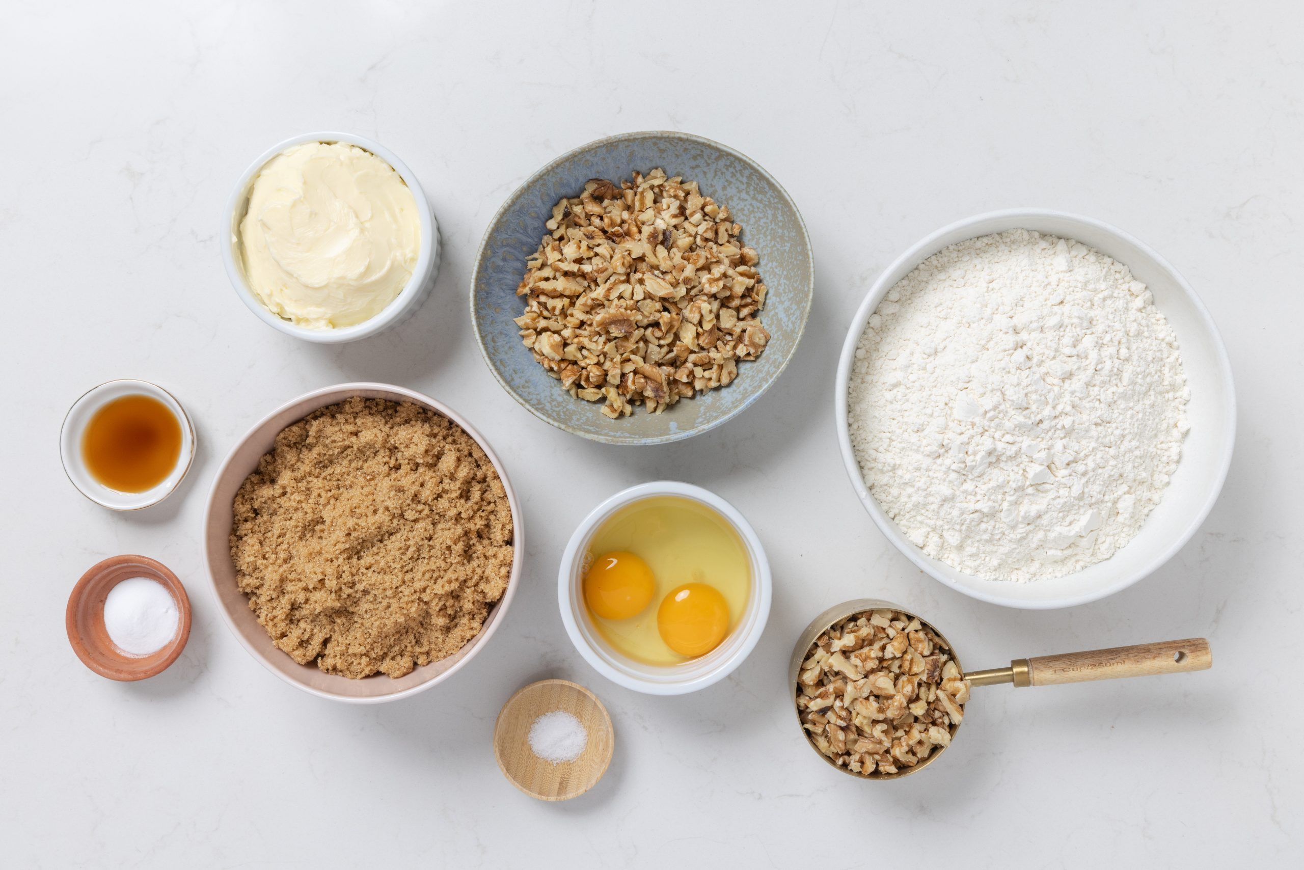 Ingredients for walnut cookies on kitchen counter.