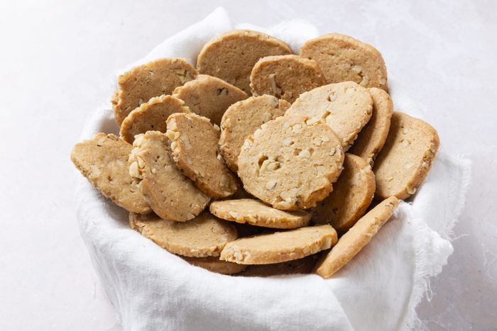 Walnut cookies in bowl.