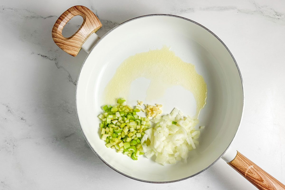 Ingredients for Taste of Home Barbecue Chicken in a white skillet