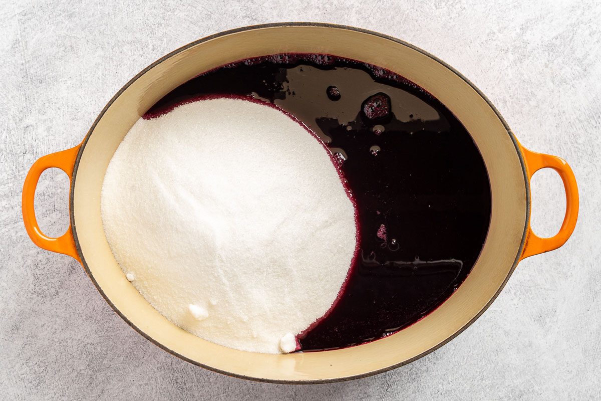 Taste of Home Blueberry Jelly Recipe photo of adding sugar and pectin to the blueberry juice.
