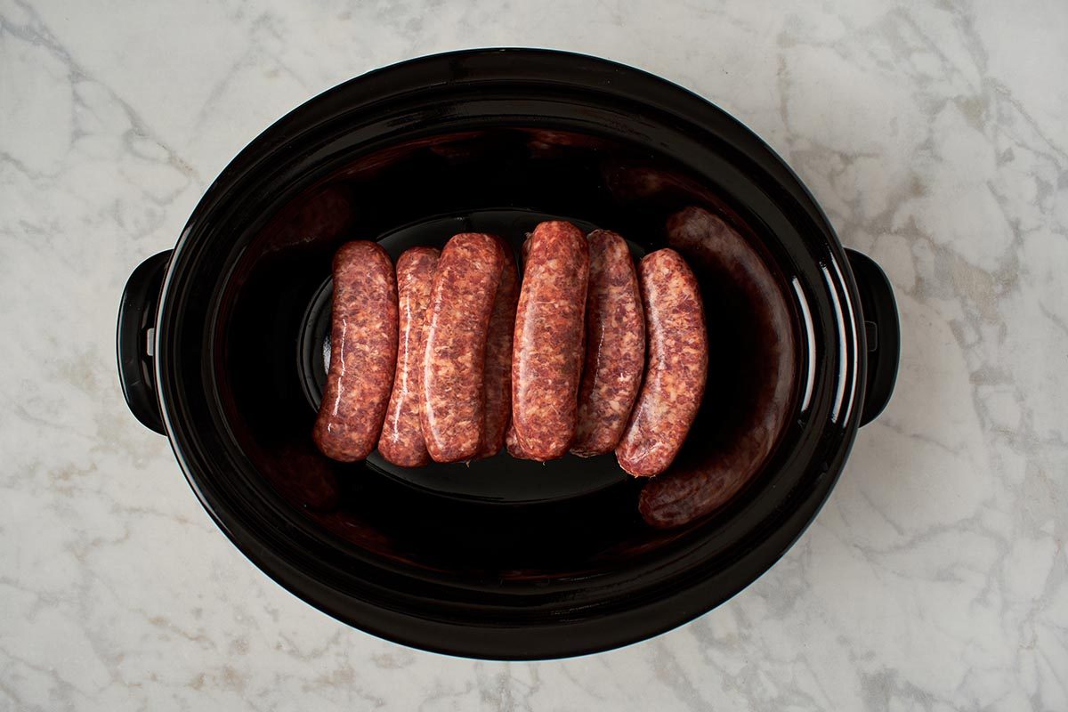 Place brats in slow cooker