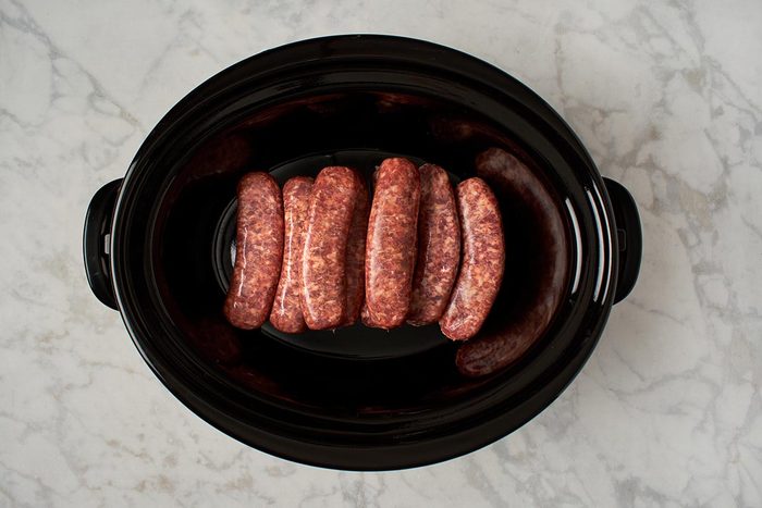 Place brats in slow cooker