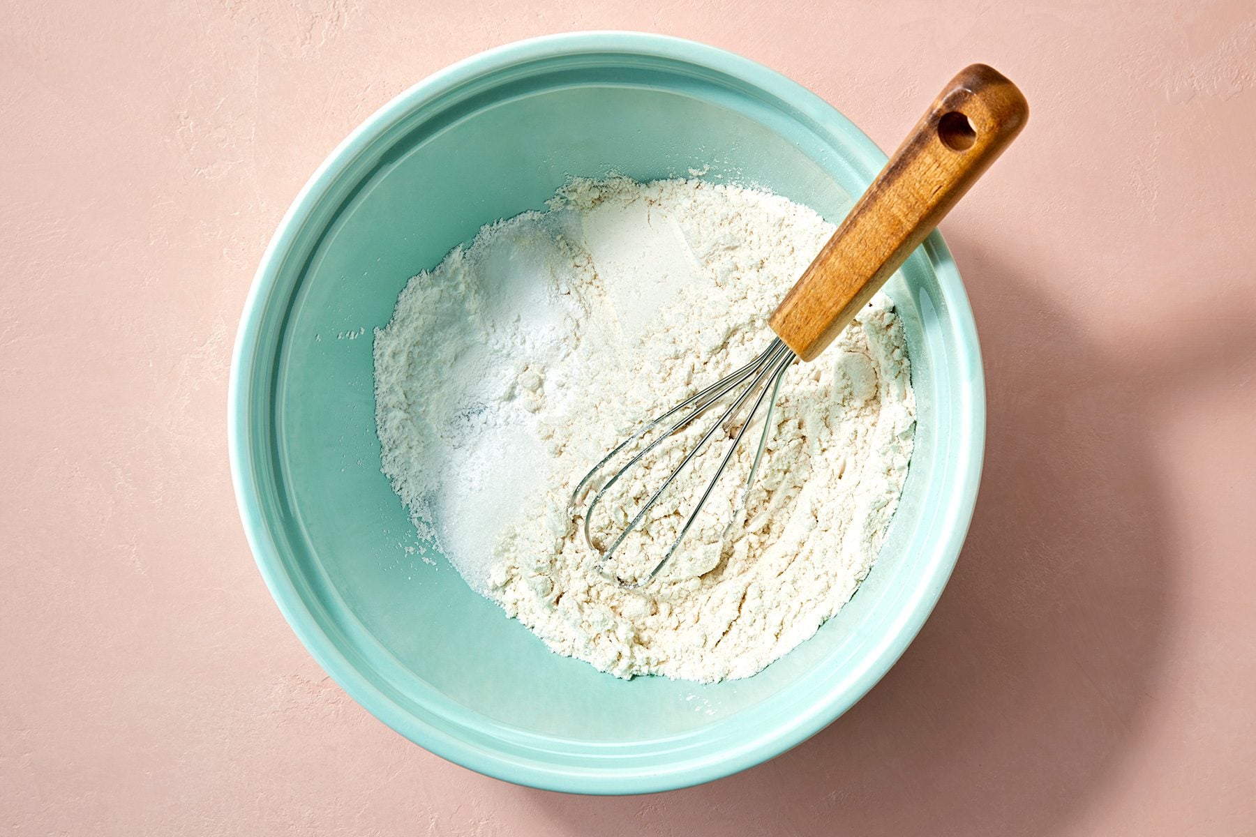 overhead shot of flour, sugar, baking powder and salt in a large bowl