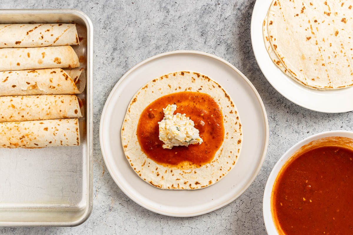Taste of Home Cheese Enchiladas recipe photo of assembling the enchiladas.