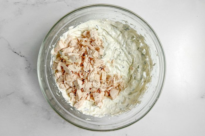 Filling ingredients for Taste of Home Chicken Manicotti in a glass bowl