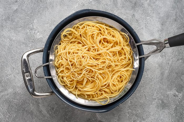 Draining the spaghetti for chicken tetrazzini.