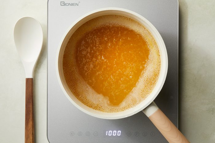 In a large saucepan; bring broth and water to a boil