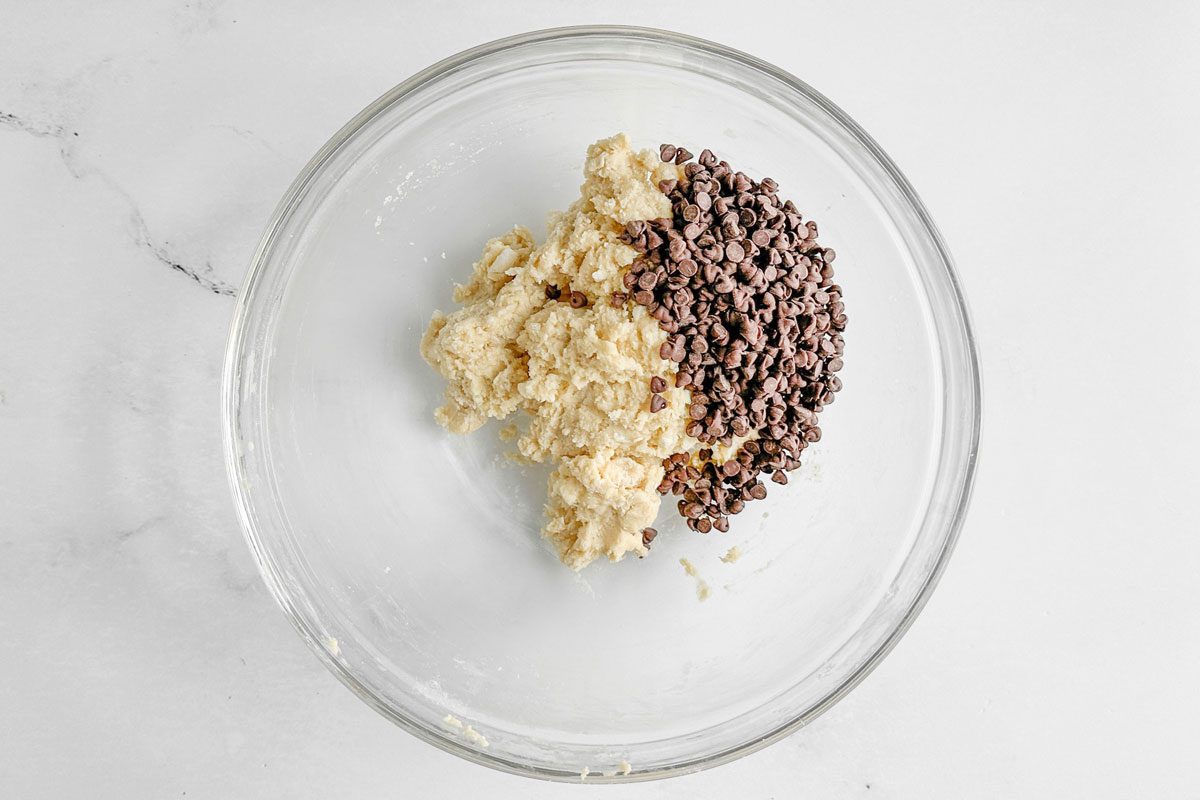 Batter for Taste of Home Chocolate Chip Scones in a glass bowl on a marble surface
