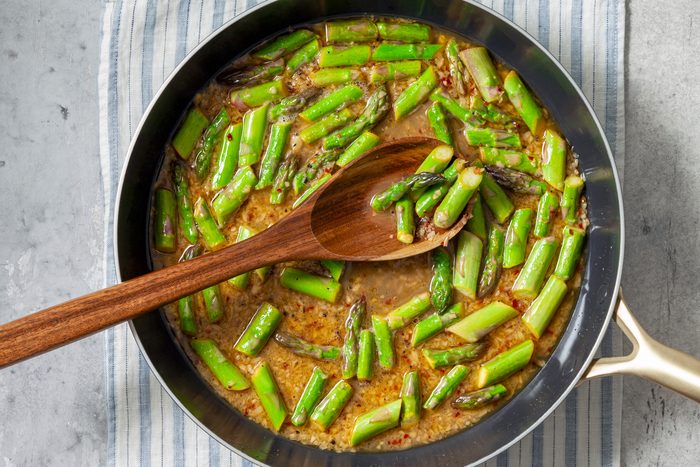 Add asparagus, lemon juice and wine