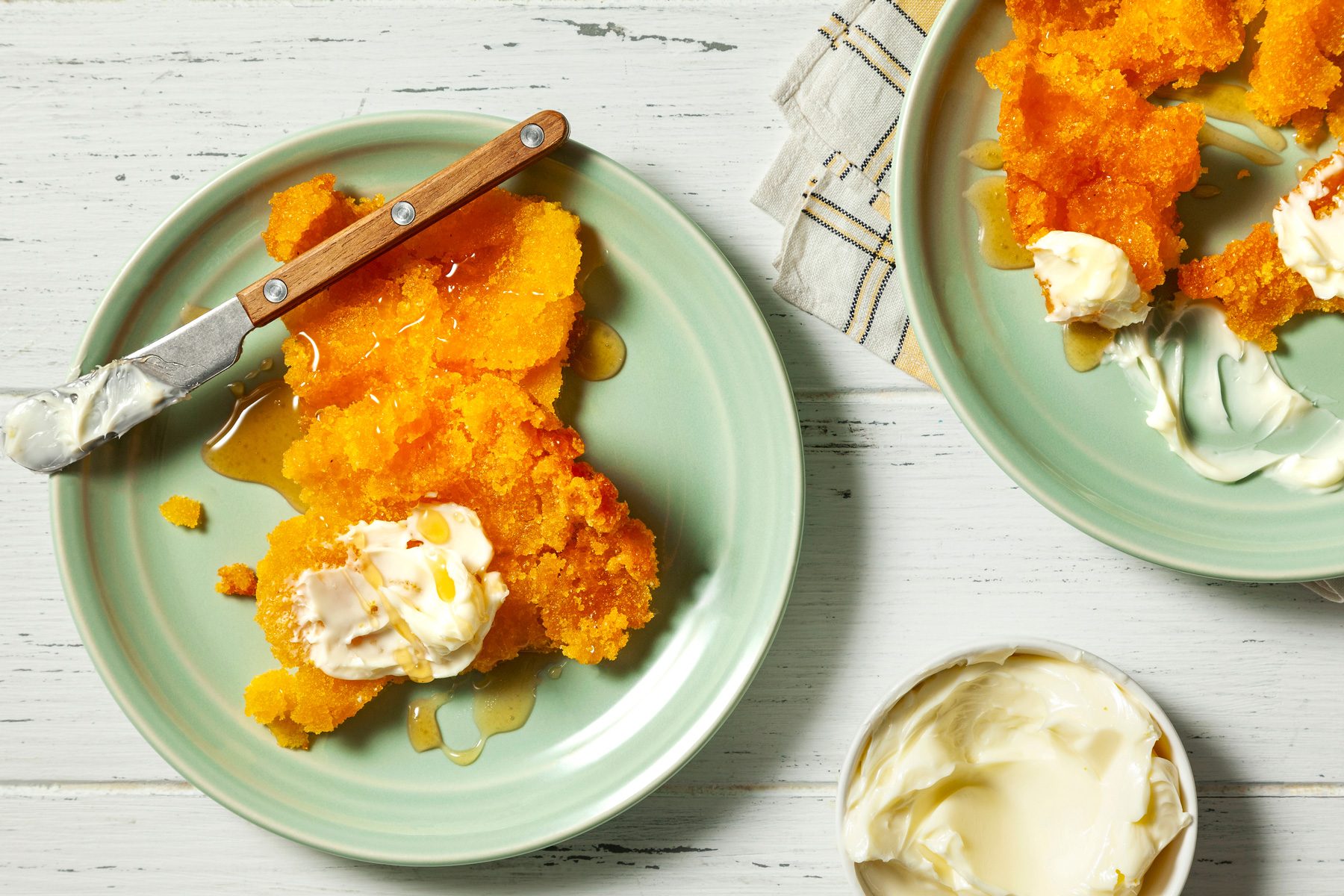 wide shot of corn pone served with butter and honey