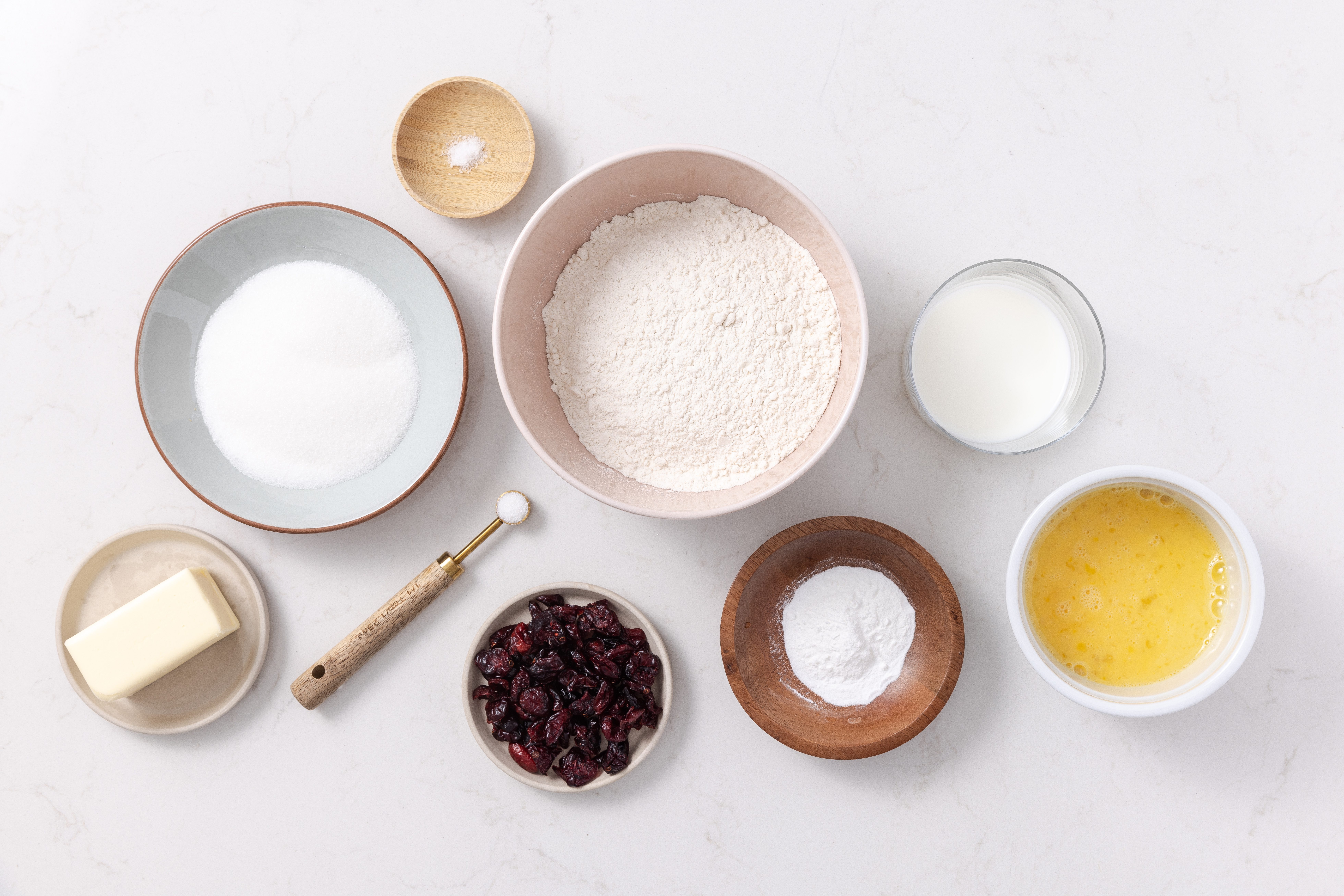 Ingredients for cranberry scones on kitchen counter.