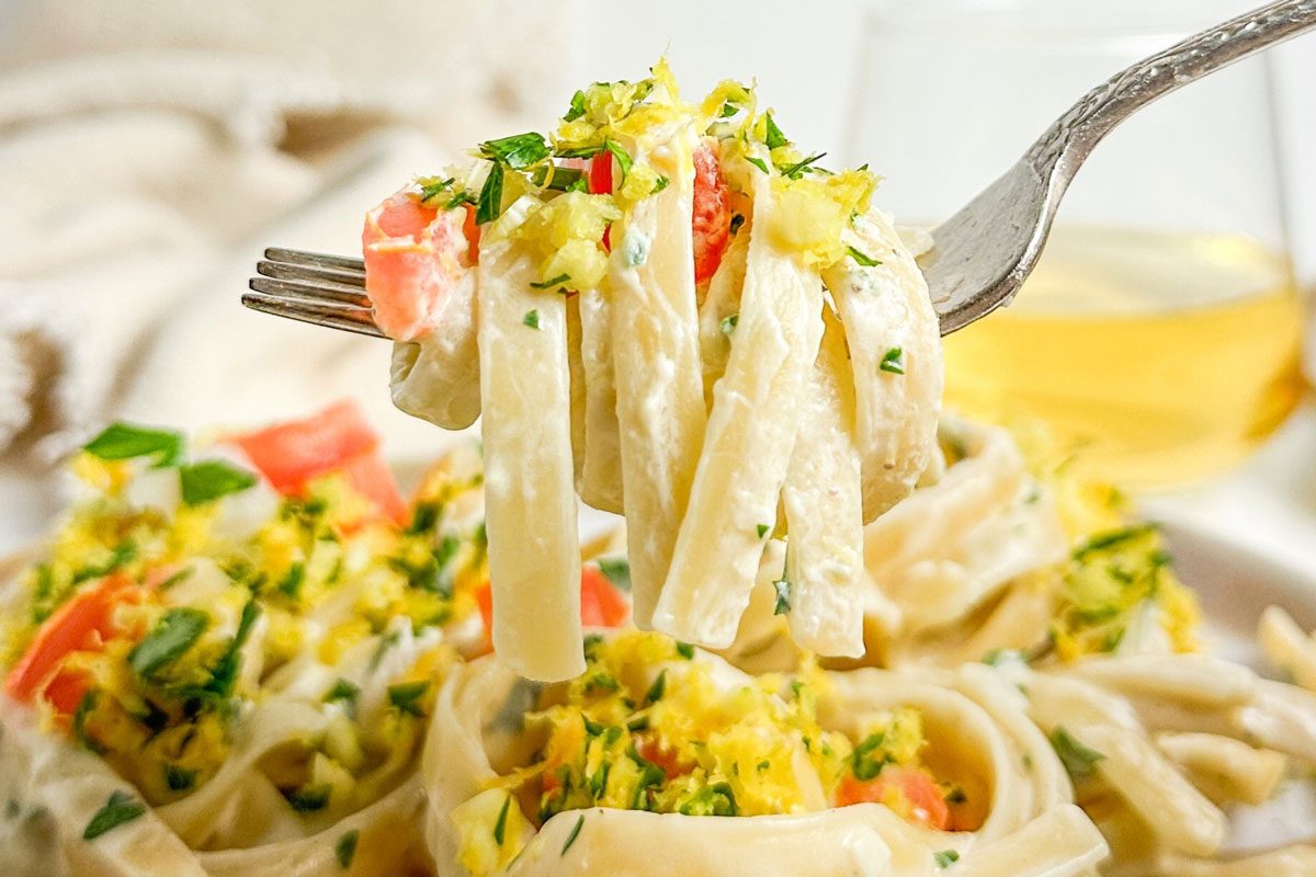 Taste of Home Creamy Lemon Pasta twirled on a fork over a ceramic plate