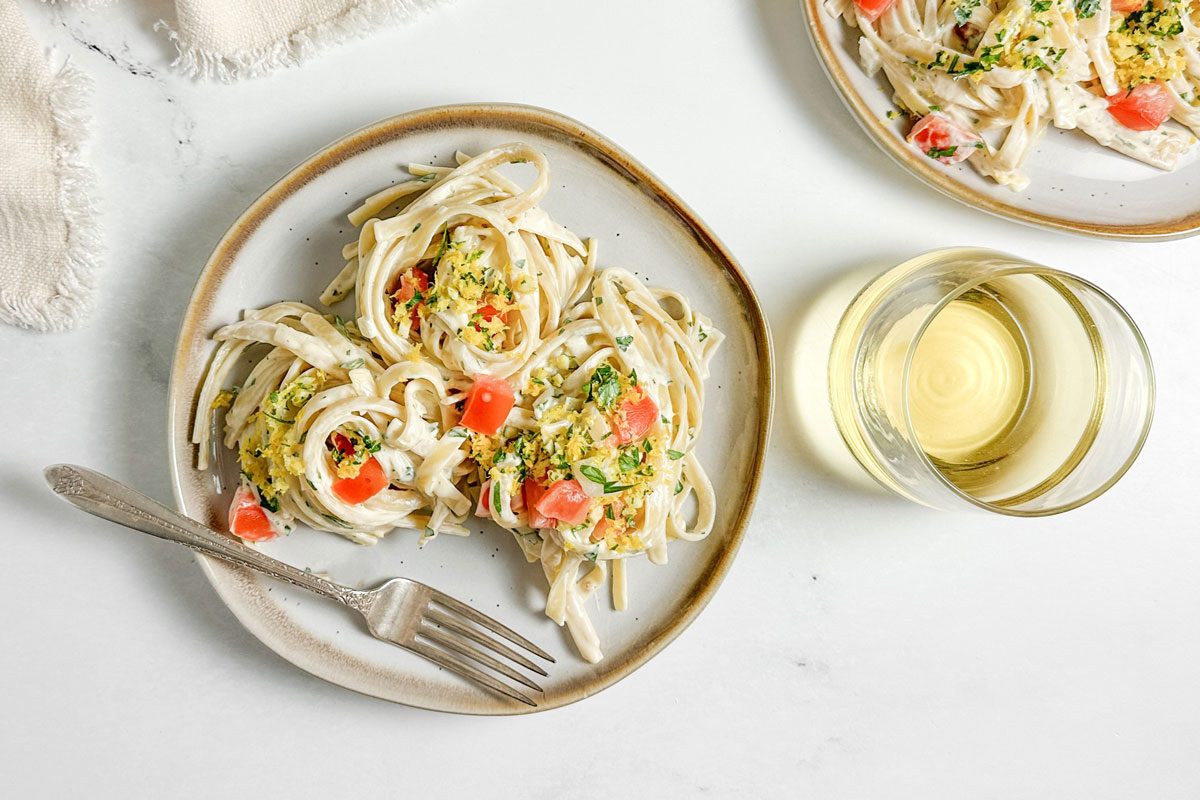 Taste of Home Creamy Lemon Pasta on ceramic plates on a marble surface