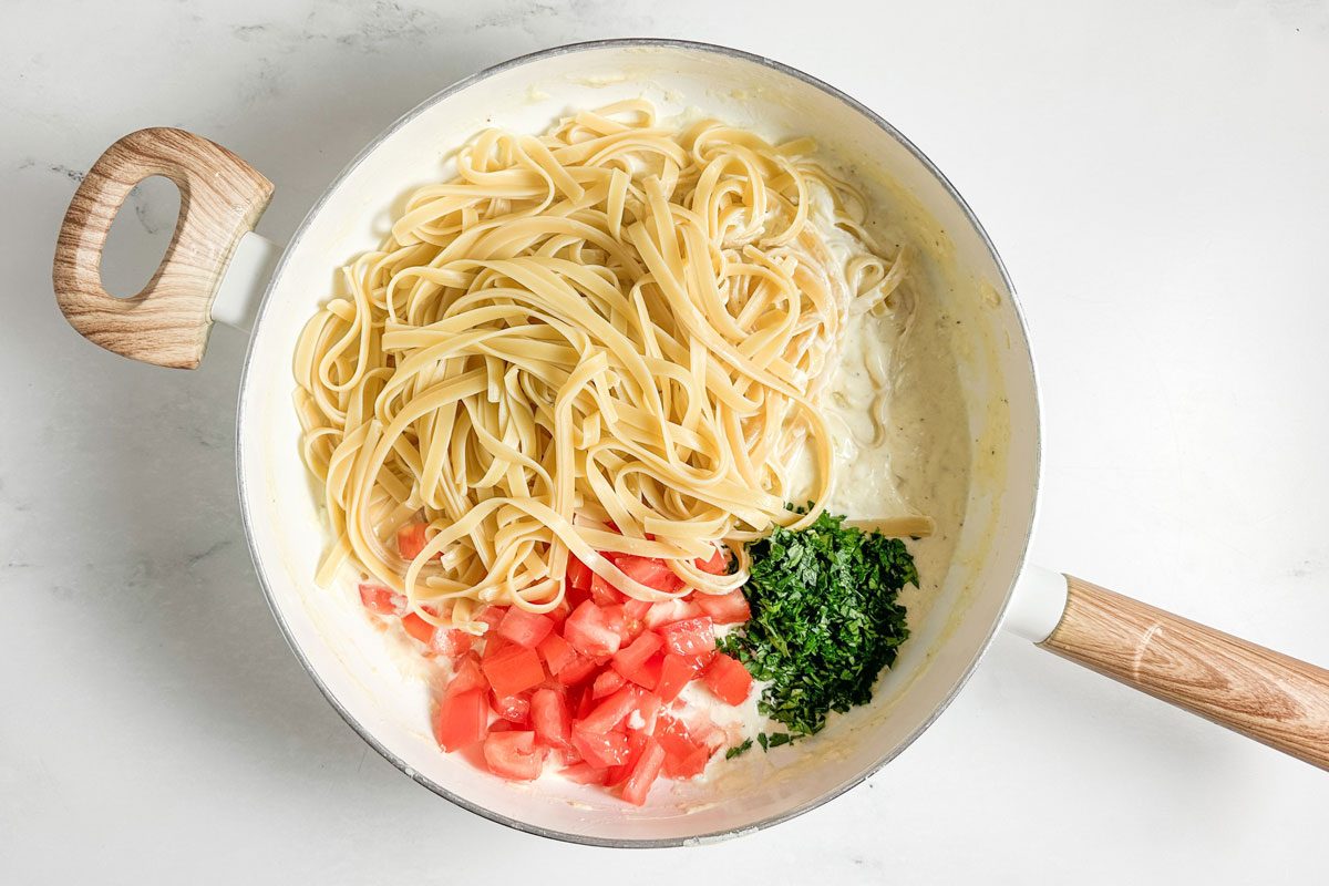 Taste of Home Creamy Lemon Pasta in a white skillet on a marble surface