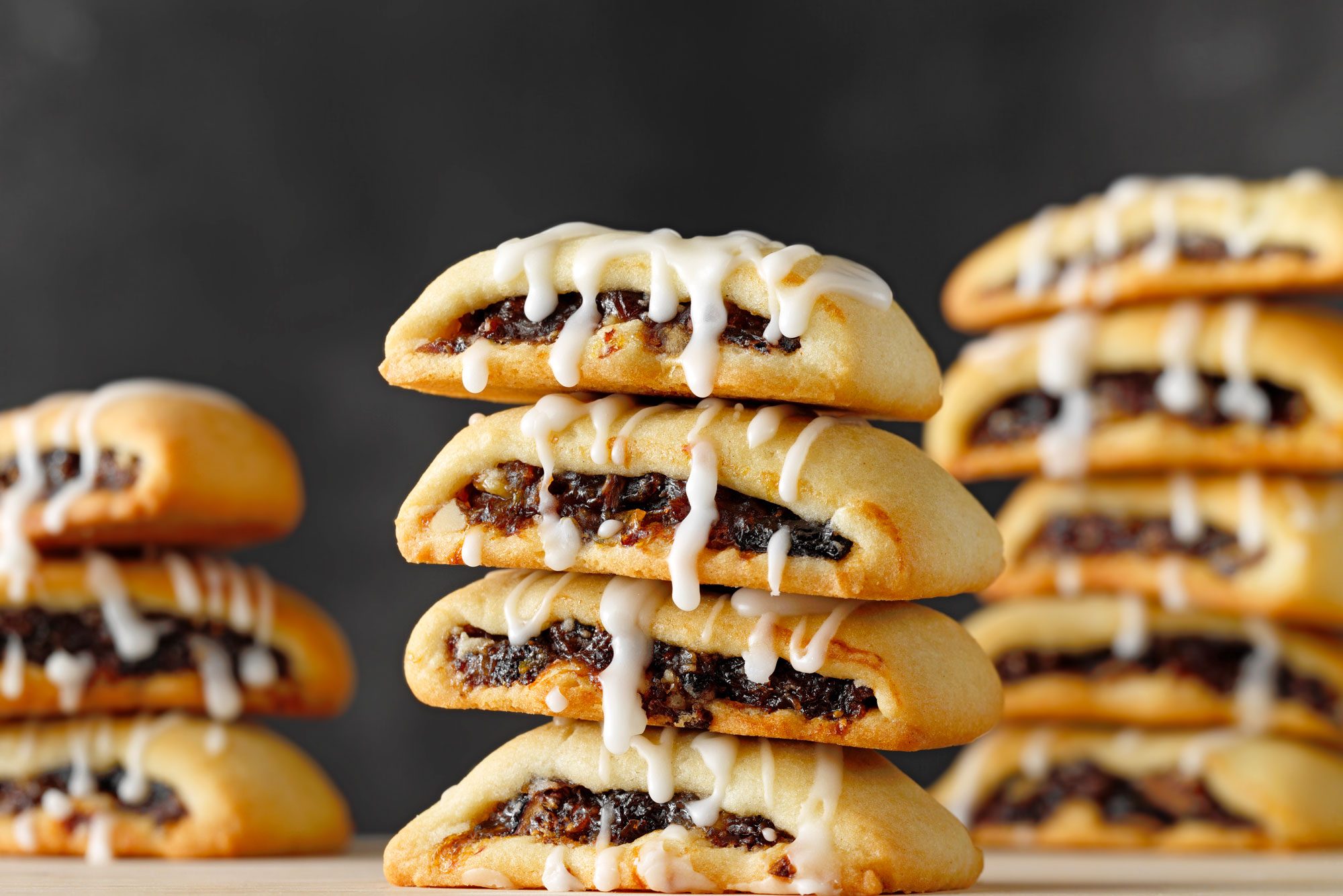 Cuccidati glazed with confectioners sugar and milk on top