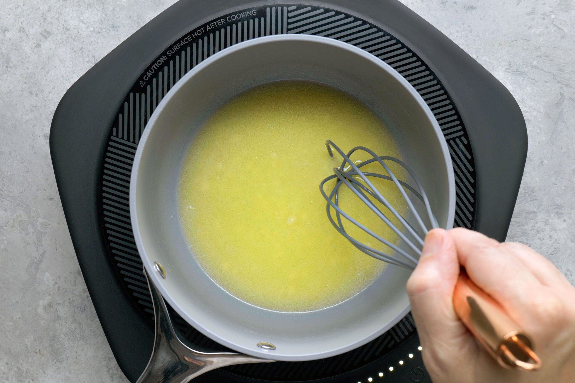 In a large sauce pan melting butter over medium heat using a whisker