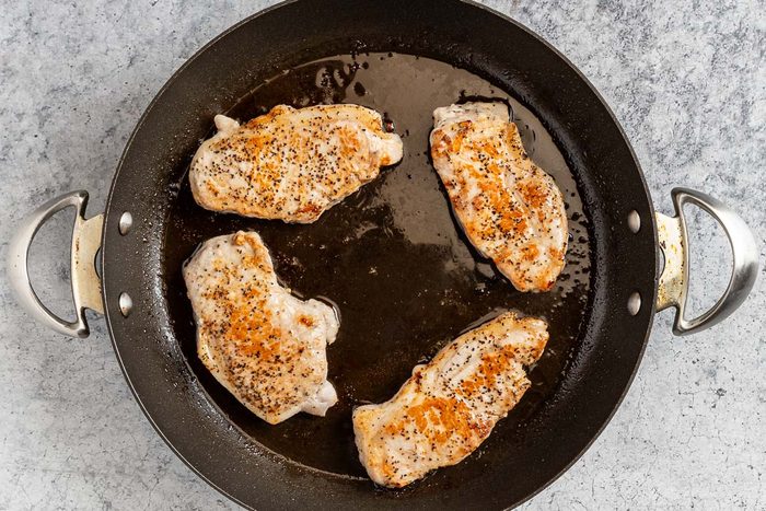 Taste of Home Hawaiian Pork Chops photo of the seasoned and seared pork chops in a skillet.