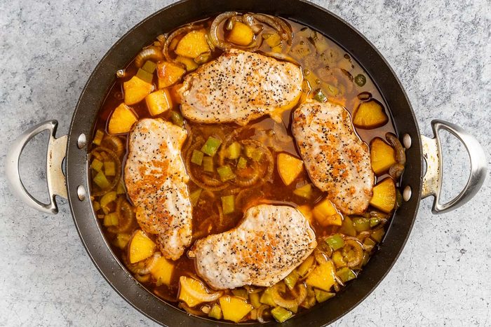 Taste of Home Hawaiian Pork Chops photo of the chops added back into the skillet to finish cooking.
