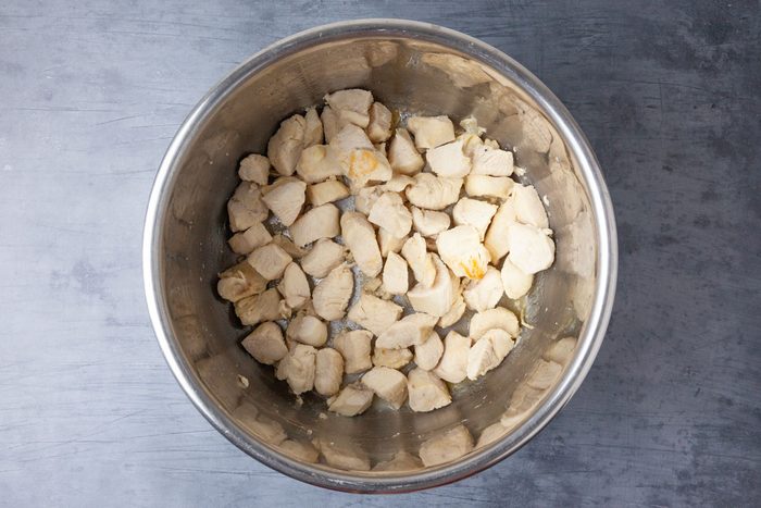 Step 3 of Taste of Home Instant Pot Chicken Curry is to pressure-cook on high for five minutes then let the pressure release naturally. Select the sauté setting and adjust to medium heat. In a small bowl, whisk together the cornstarch and a tablespoon water. Add the cornstarch mixture to the pot and let it simmer uncovered for five minutes.