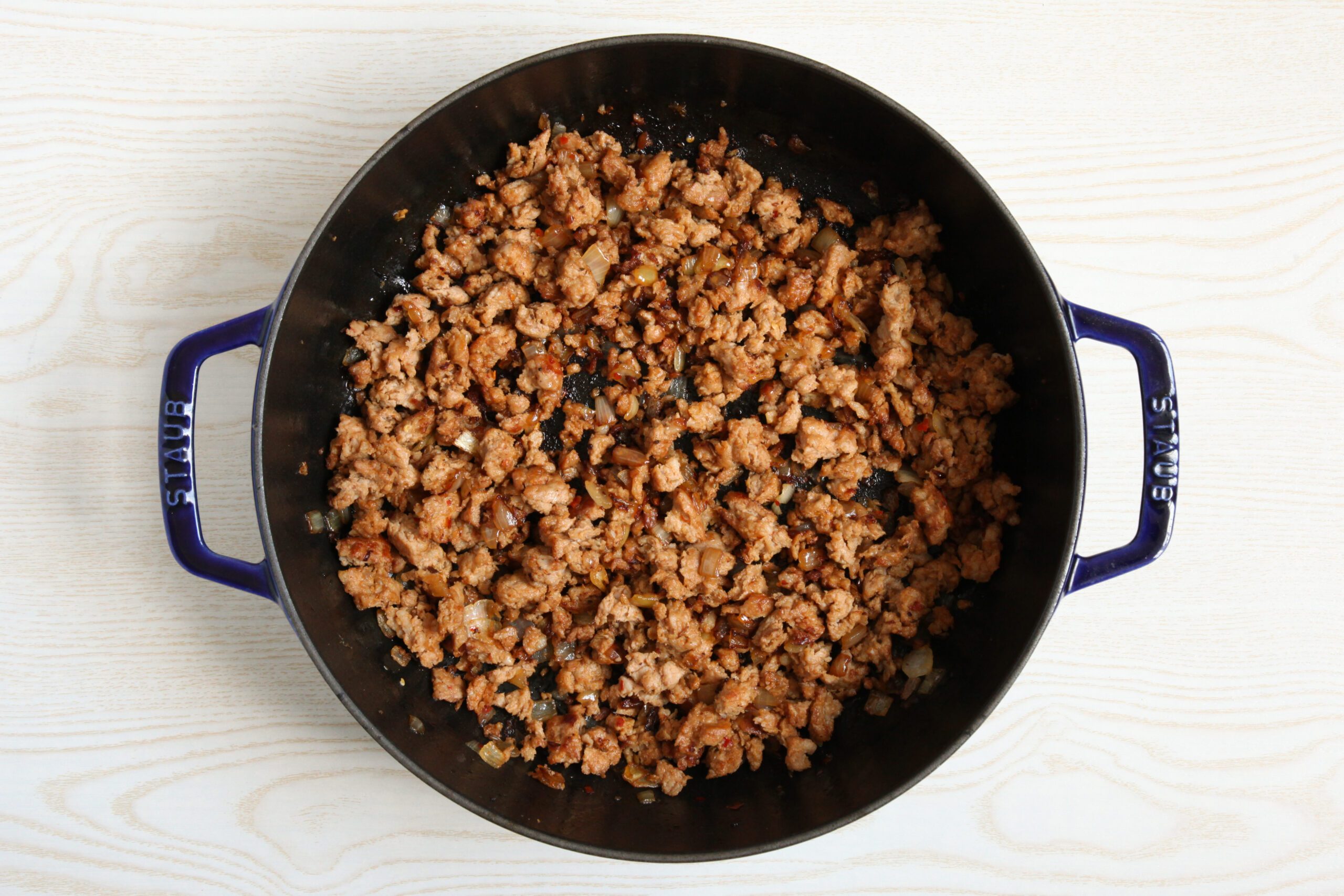 Browning sausage and onion