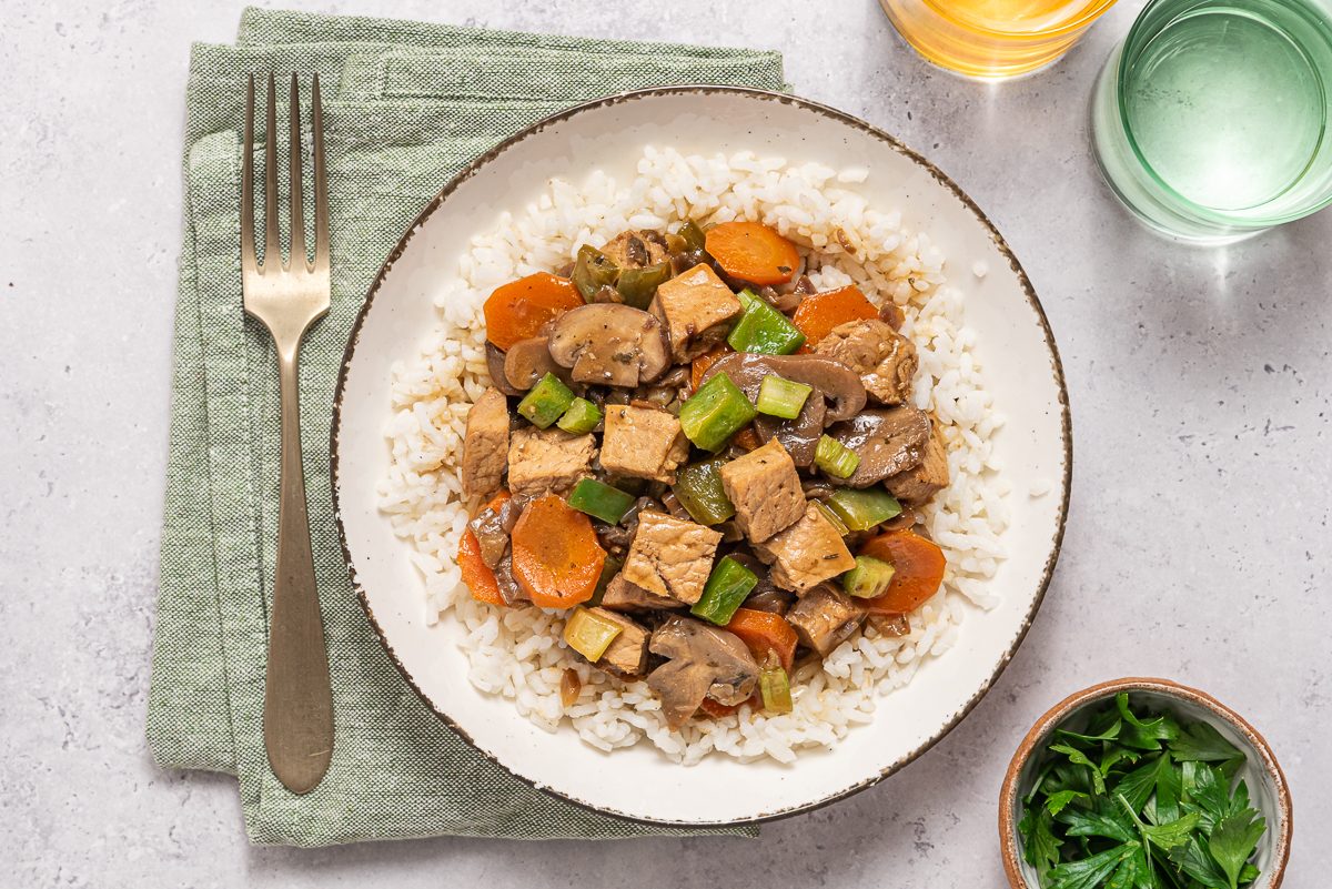 Closeup Of Plate With Rice, Vegetables And Leftover Pork