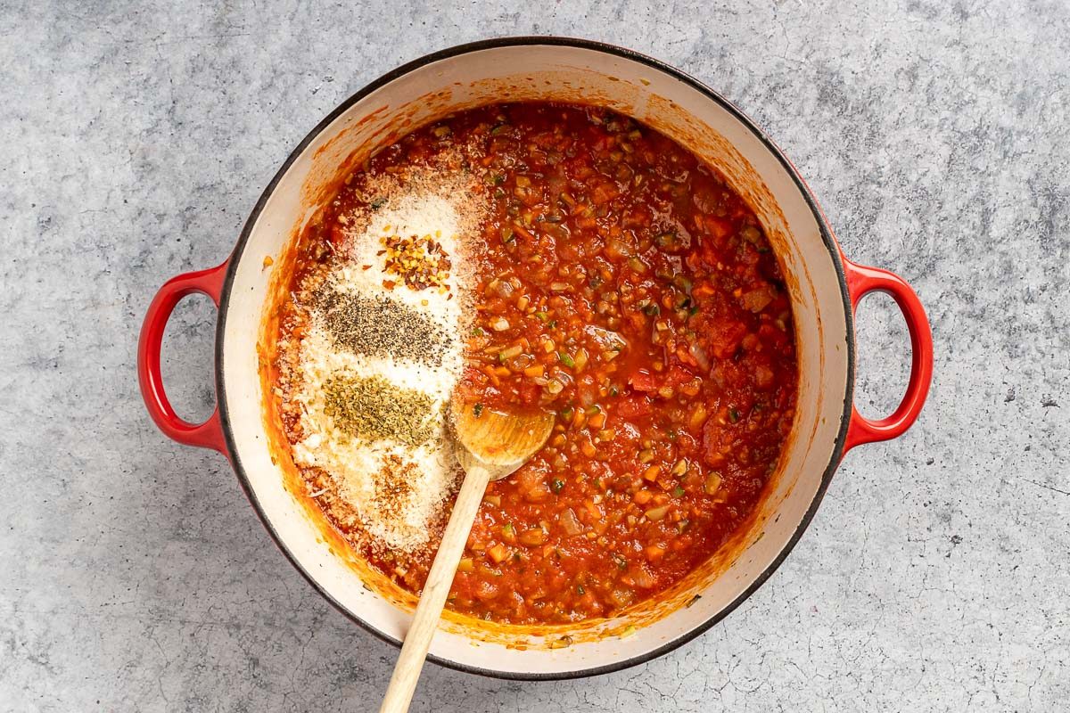Taste of Home Mushroom Bolognese recipe photo of adding the tomatoes and seasonings.