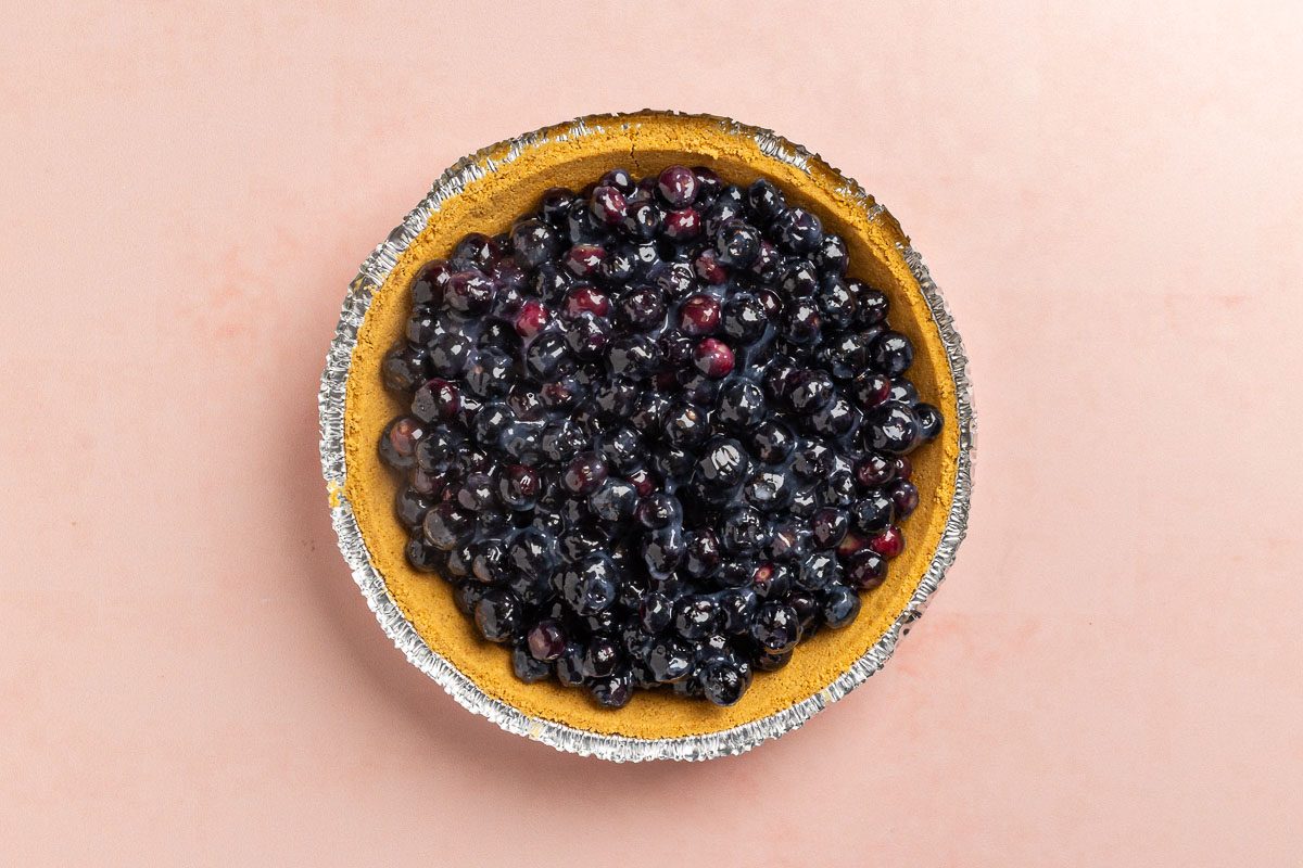 Taste of Home No Bake Blueberry Pie recipe photo of blueberry filing added to the crust.