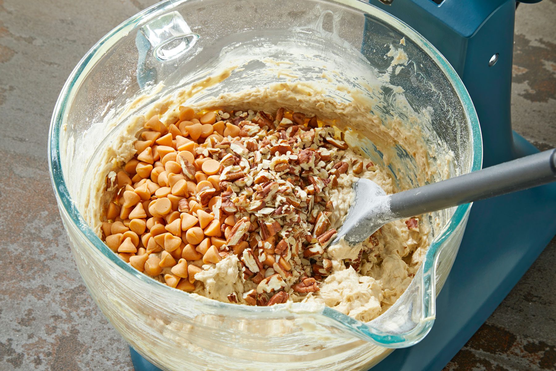Butterscotch chips and chopped pecans added to the cookie mixture.