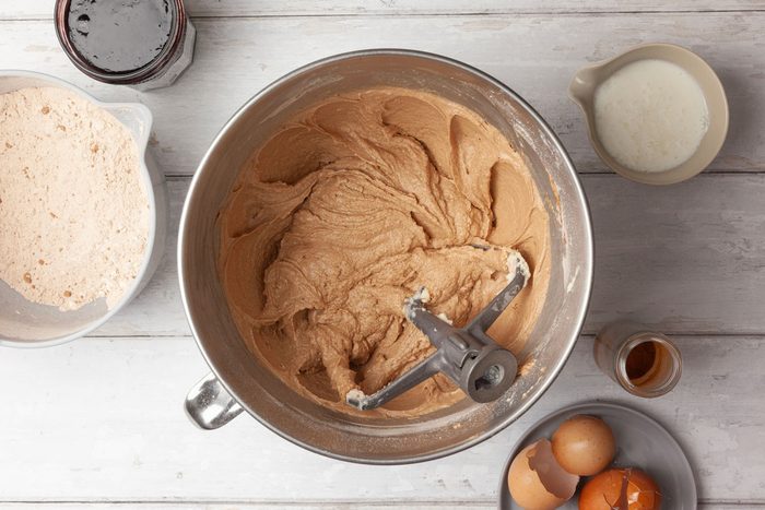 Step 2 of Taste of Home Jam Cake is to cream the butter and sugar together in a large mixing bowl for 5 to 7 minutes, or until they’re light and fluffy. Add the eggs one at a time, beating the mixture well after each addition. Combine the dry ingredients and whisk them until they’re well mixed. Gradually add the dry ingredients to the bowl, alternating them with the jam and the buttermilk. Beat the batter well after each addition. Stir in the raisin mixture and the nuts.