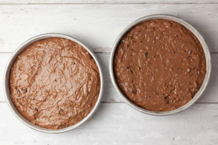 Step 3 of Taste of Home Jam Cake is to spread the batter into two greased and floured 9-inch round cake pans. Bake the cake layers at 350°F for 40 to 455 minutes, or until a toothpick inserted into the center comes out clean. Cool the layers in their pans on a wire rack for 10 minutes, then turn them out of the pans to finish cooling on the wire rack.