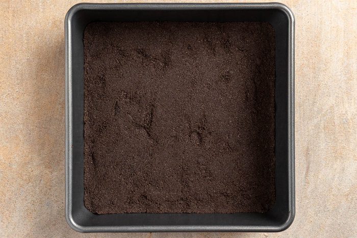 Taste of Home Peanut Butter Lasagna recipe photo of the cookied crust in a 9 inch baking pan.